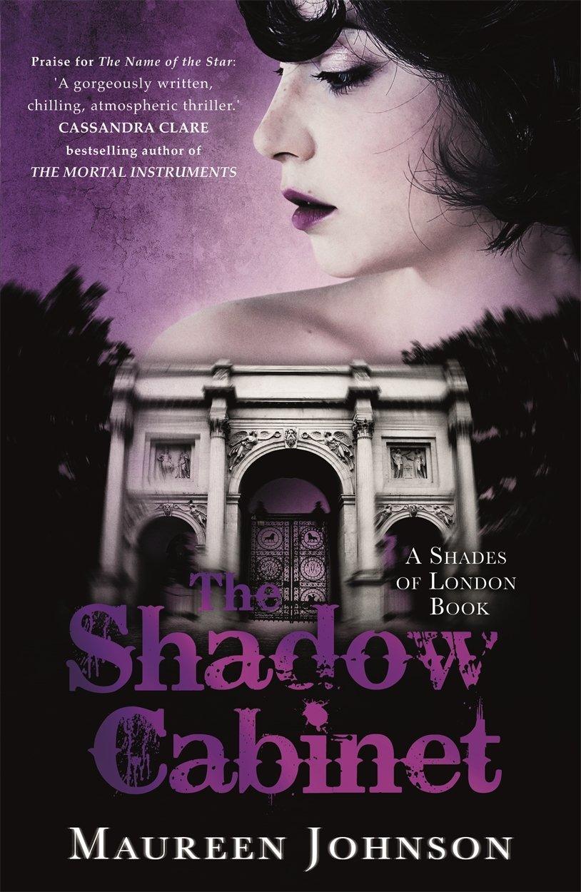 Book cover of "The Shadow Cabinet: A Shades of London Novel" by Maureen Johnson featuring a profile of a woman with dark hair and pink clouds above an illustrated door, combining elements of thrilling adventure and intrigue.
