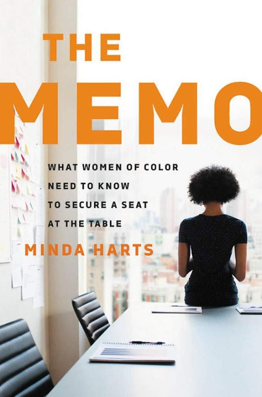 Book cover of "The Memo: What Women of Color Need to Know to Secure a Seat at the Table" by Minda Harts featuring a woman of color exemplifying women of color empowerment, sitting at a conference table, looking out a window in a high-rise office.