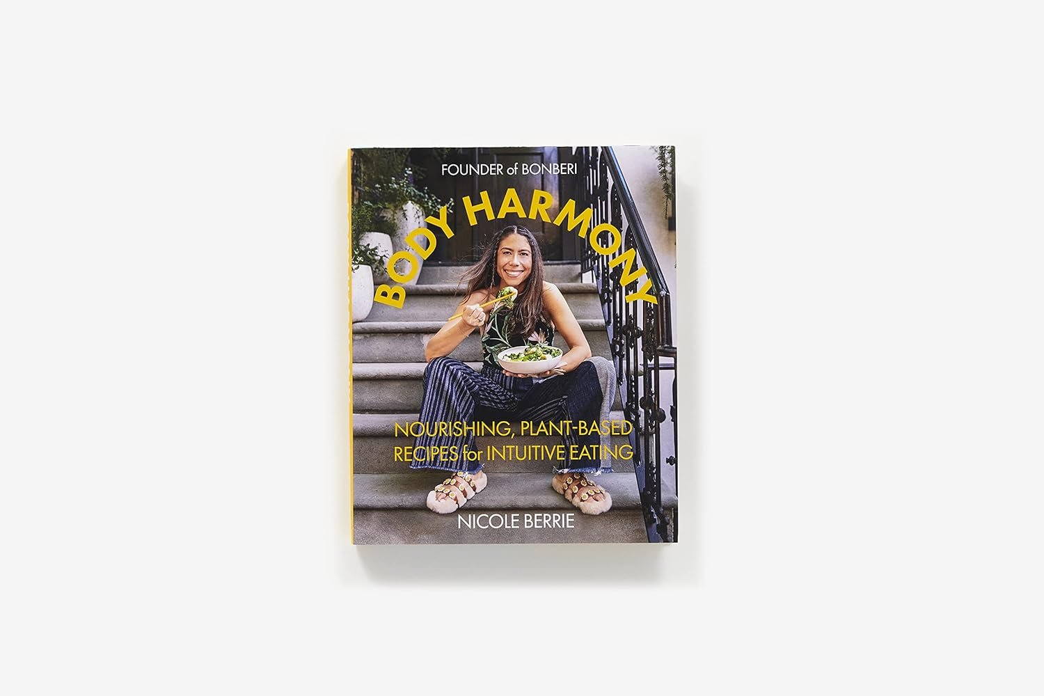 a book with a woman eating food on the cover