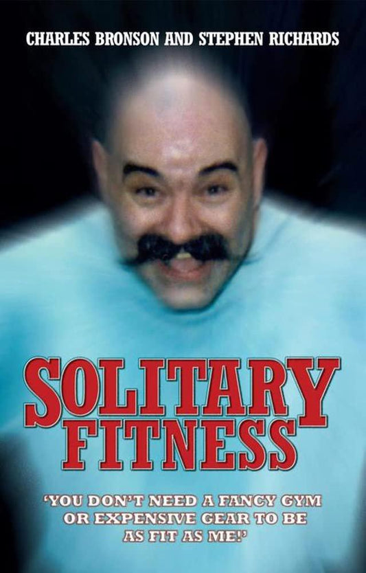Cover of the book "Solitary Fitness" by Charlie Bronson and Stephen Richards. The cover displays a blurred image of Charles Bronson, smiling, with the text highlighting fitness through home workouts without fancy gym equipment.